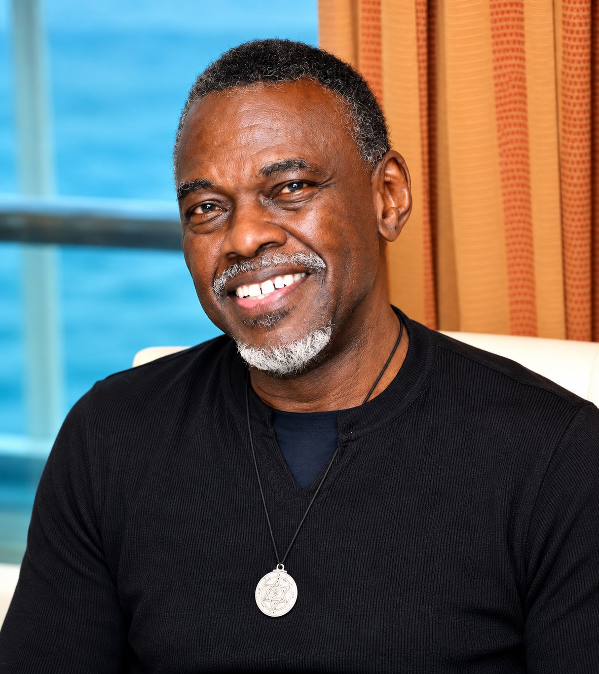 Leroy &ldquo;Roy&rdquo; Dingle smiling, with the ocean behind him